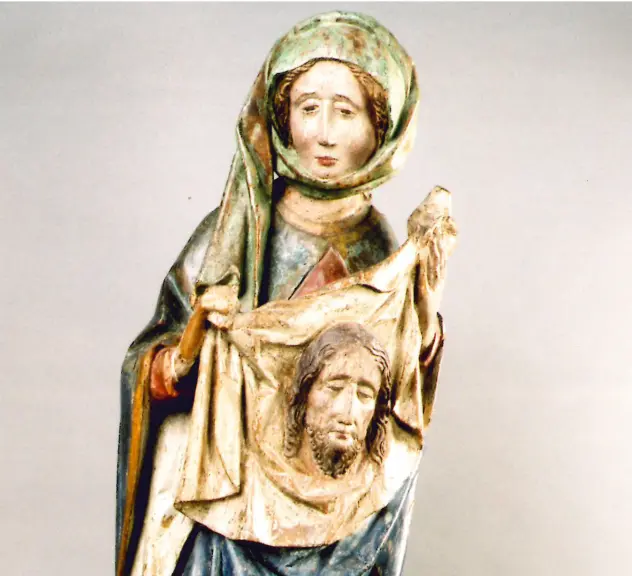 Geschnitzte Skulptur einer Dame, die den Kragen des Umhangs eines vor sich knienden Mannes mit langen Haaren in ihren Händen hält