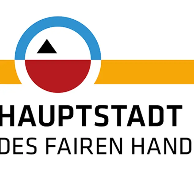 Gelb/rot/blaues Logo des Hauptstadt des Fairen Handels Wettbewerb der Servicestelle der Kommunen in der Einen Welt