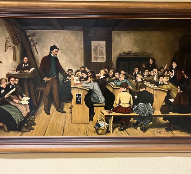 Gemälde im Rahmen zeigt eine Szene einer historischen Schulstunde